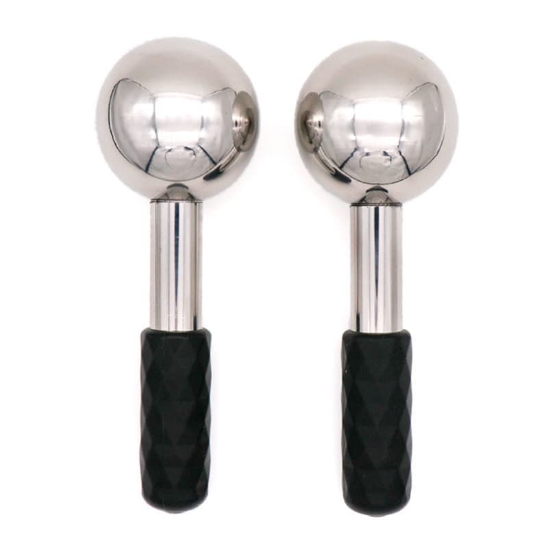 Pair of polished stainless steel cryo facial globes with black textured grip handles