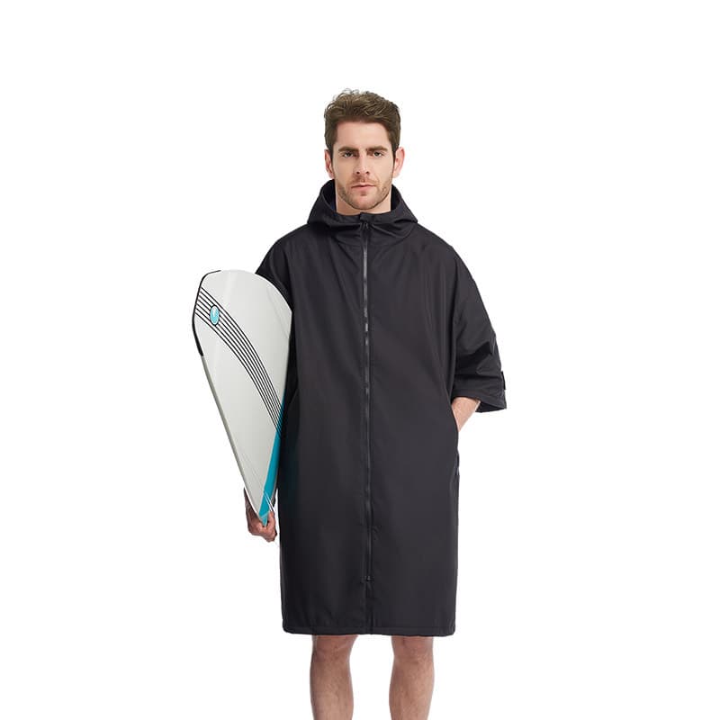 Thermal change robe in black worn front-on, full-length zip and deep hood